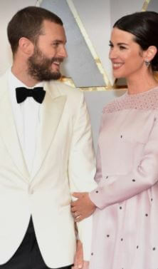 Jessica Dornan sibling Jamie Dornan and sister-in-law Amelia at an event.